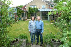 Anne Cooper and Simon Ruffle in the garden of the &#39;Eco-Home&#39;
